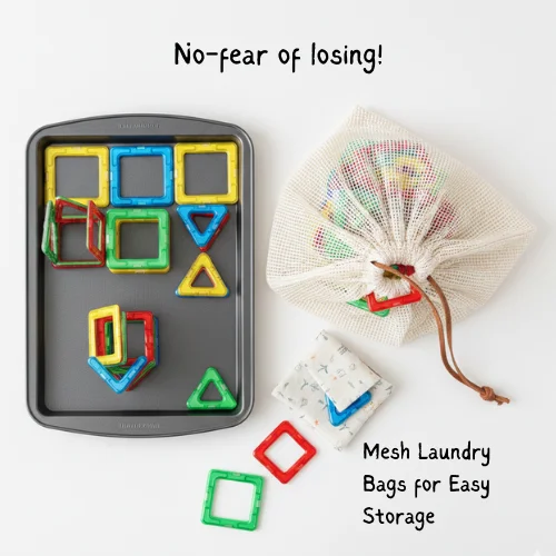 Magnetic tiles organized in a white mesh laundry bag and on a metal baking tray for mess-free travel storage